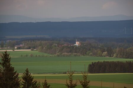 Panoramic shot of a beautiful Sussex hamlet of South Stoke near Arundel. A few houses and the 11th Century flint Church of St Leonards surrounded by lush green horse pastures. Czech Republicの写真素材