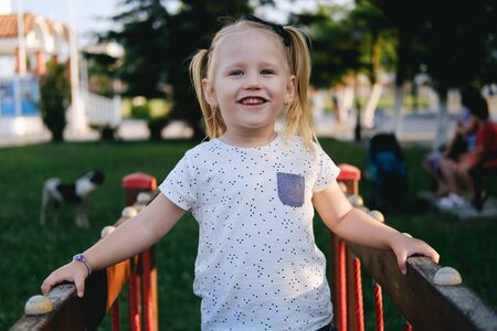 Girl playing in a children's activities parkの写真素材
