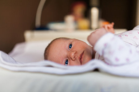 Baby laying in bed