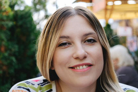 Portrait of a young woman enjoying outdoor
