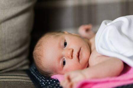 Baby girl in bedの写真素材