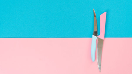 Composition of two colors - knives on a two-tone backgroundの写真素材