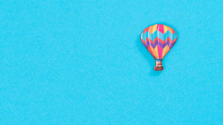 Collage - hot air balloon on a blue background with space for textの写真素材
