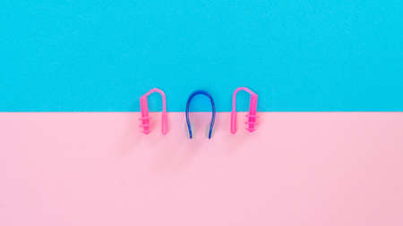 Swimming kit - nose clip, earplugs in the ears, color compositionの写真素材