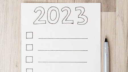 To-do list for 2023 on a white sheet with squares for checkmarks and lines for inscription. high...