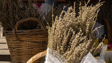 Bouquet of dried lavender flowers in a wicker basket. high quality photoの写真素材