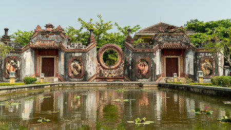 temple with reflection in the pond in the gardenの写真素材