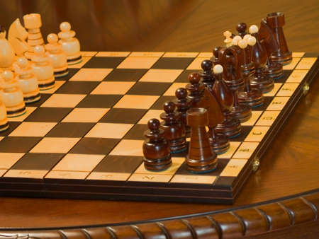 Black and white piece on the chess-board. Pawns before start.の写真素材