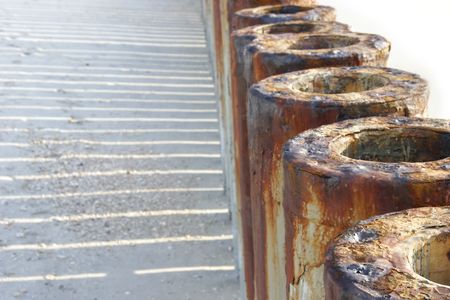 rusty tubes, partly isolated over white, shallow DOFの写真素材
