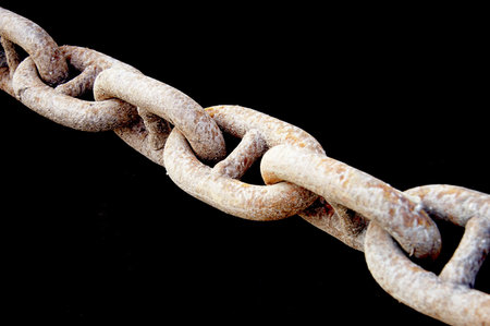 old rusty chain over black