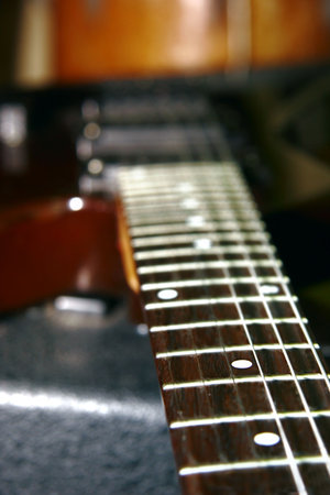 close up of guitar neck, very shallow DOF