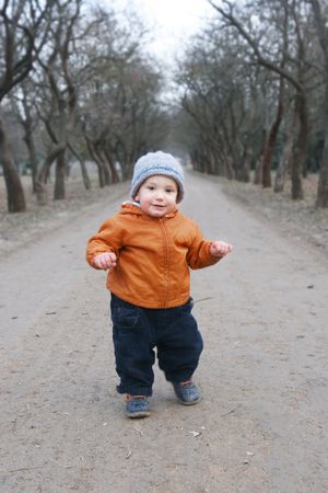  boy making his first steps in parkの写真素材