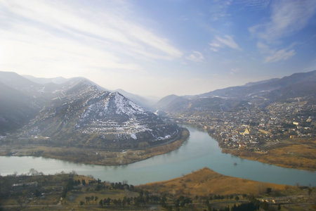 river junction on mountains and sky backgroundの写真素材