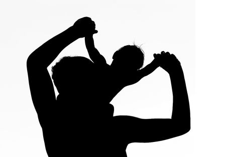 silhouette of father playing with his son over whiteの写真素材
