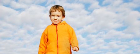happy boy on sky backgroundの写真素材