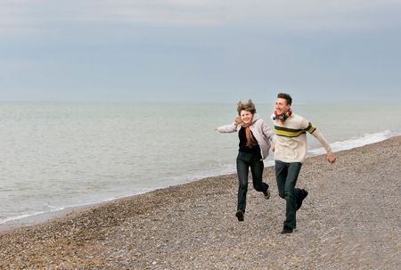 young couple having fun on beachの写真素材