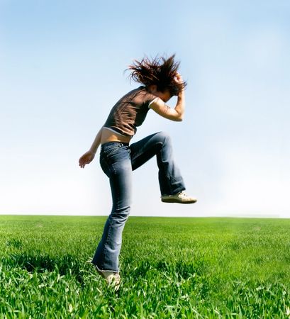 jumping girl on natural backgroundの写真素材