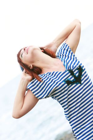 happy girl in sailor's striped vestの写真素材