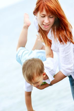happy mother and son on beachの写真素材