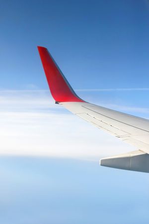 plane wing on sky backgroundの写真素材