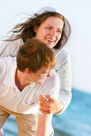 young happy couple on natural backgroundの写真素材