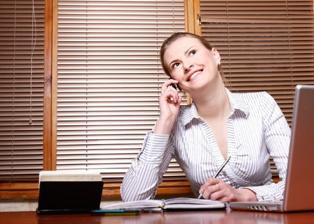 attractive business woman at working placeの写真素材