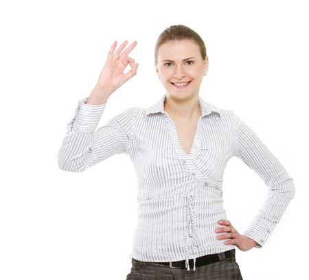 attractive business woman showing ok over whiteの写真素材