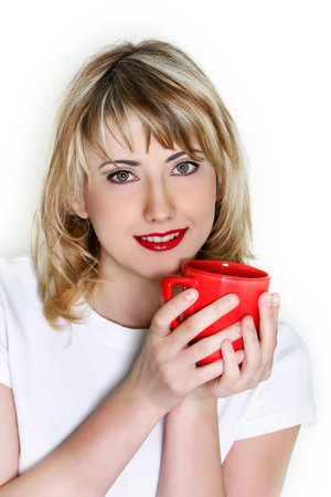 close up portrait of attractive young girl with red cup over whiteの写真素材