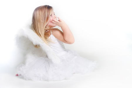 studio shot of little angel girl の写真素材