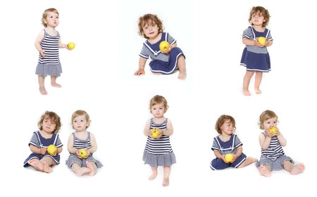 two toddler girls with green apples, collectionの写真素材