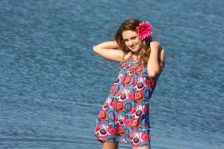 young beautiful girl on sea backgroundの写真素材