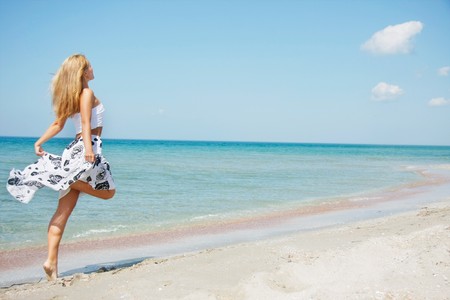 young happy girl on beachの写真素材