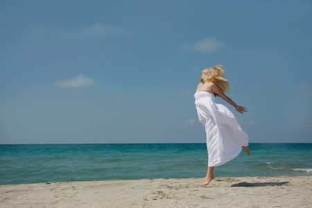 young happy girl on beachの写真素材