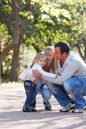 happy family in parkの写真素材