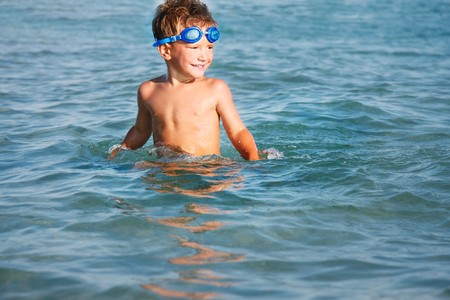 happy boy swimming in the seaの写真素材