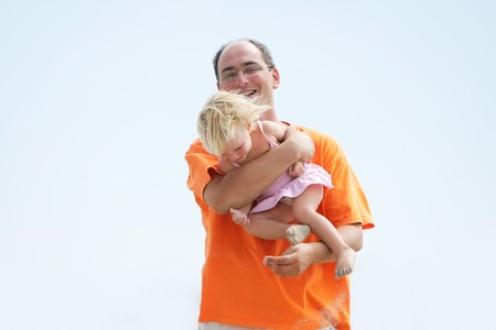 playing father and daughter on sky backgroundの写真素材