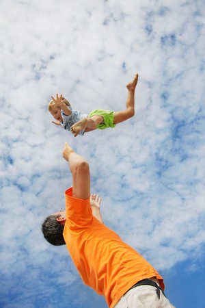 flying child on sky backgroundの写真素材