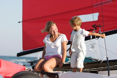 happy mother and son on sea yacht backgroundの写真素材