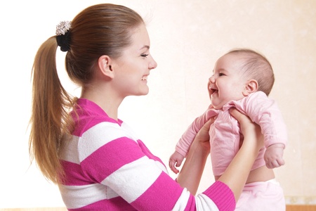 young mother and baby at homeの写真素材