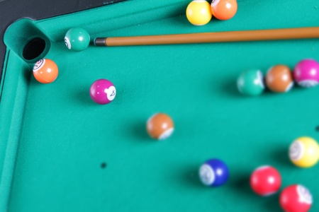 billiard balls and cue on tableの写真素材