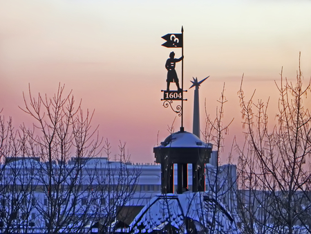 Winter view of the Siberian city Tomsk at sunset from the heights of ancient roofs.の写真素材