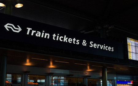 Train tickets and Services by railway operator Nederlandse Spoorwegen in Amsterdam Schiphol Railway Station.のeditorial素材