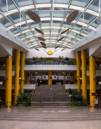 Minsk, Belarus - March 9, 2016: National Library of Belarus modern interior view. Several visitors are walking in the library hall.のeditorial素材