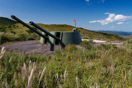 Russia, Primorskiy Region, historical monument on Gamov peninsula. Russian artillery battery turret gun, Cannon on the Hill.の写真素材