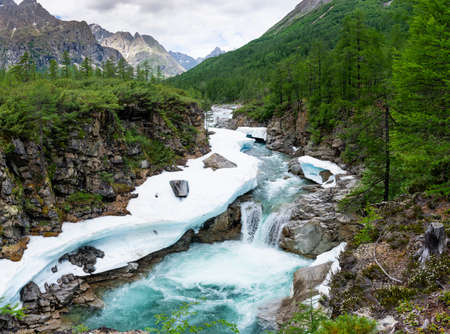 The beautiful valley of the Middle Sakukan river against the backdrop of the Kodar mountain range. Trans-Baikal Territory, Kodar National Park.の写真素材