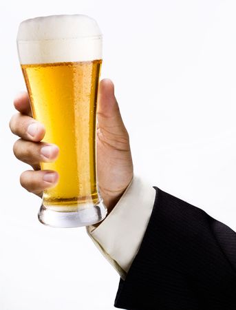 Glass of beer is in a handの写真素材