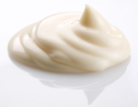 handful of mayonnaise on white backgroundの写真素材