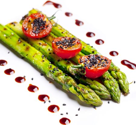 Fried green asparagus on a white backgroundの写真素材