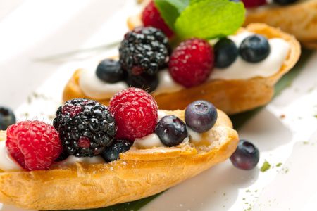 Two sweet tarts with fresh fruitsの写真素材