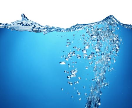 Air bubbles rise from the bottom of the ocean to the surface. Above the water is a white background.の写真素材